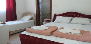 Postel nebo postele na pokoji v ubytování Apartmani Jacimovic