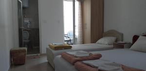 Postel nebo postele na pokoji v ubytování Apartmani Jacimovic