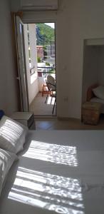 Postel nebo postele na pokoji v ubytování Apartmani Jacimovic