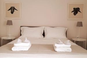 Säng eller sängar i ett rum på Eutopia Luxury Studio