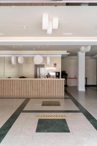 a large lobby with a reception desk in a building at Hotel Santa Rosa in Torrox Costa