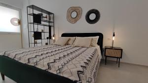 Postel nebo postele na pokoji v ubytování Dimore Gilas - Suite Menta