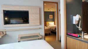 Voodi või voodid majutusasutuse ibis Styles Bogor Pajajaran toas