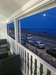 a balcony of a house with a view of the ocean at Wns Southend -on-Sea in Southend-on-Sea