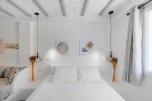 A bed or beds in a room at Endless Blue from Syros - Megas Gialos Resort - Suite 1