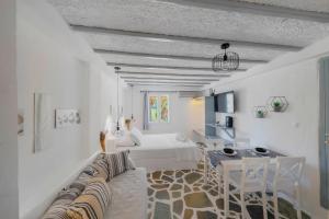 A bed or beds in a room at Endless Blue from Syros - Megas Gialos Resort - Suite 1