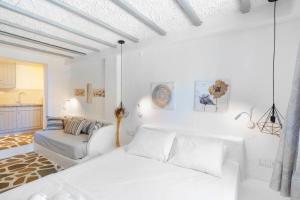 A bed or beds in a room at Endless Blue from Syros - Megas Gialos Resort - Suite 1