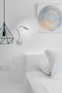A bed or beds in a room at Endless Blue from Syros - Megas Gialos Resort - Suite 1