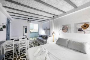 A bed or beds in a room at Endless Blue from Syros - Megas Gialos Resort - Suite 1