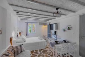 A bed or beds in a room at Endless Blue from Syros - Megas Gialos Resort - Suite 1