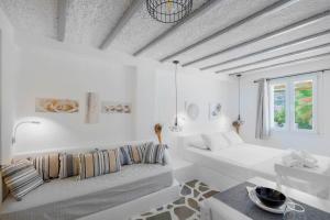 A bed or beds in a room at Endless Blue from Syros - Megas Gialos Resort - Suite 1