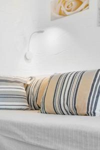 A bed or beds in a room at Endless Blue from Syros - Megas Gialos Resort - Suite 1