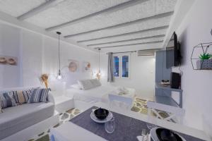 A television and/or entertainment centre at Endless Blue from Syros - Megas Gialos Resort - Suite 1