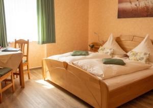 a bedroom with two beds and a table and a table and a table at Perle am Rhein in Boppard