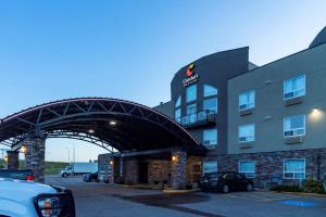 a large building with a clock on top of it at Comfort Inn & Suites Medicine Hat in Medicine Hat