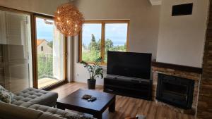 TV a/nebo společenská místnost v ubytování Villa Amalia Apartments