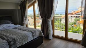 Postel nebo postele na pokoji v ubytování Villa Amalia Apartments