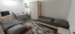 TV a/nebo společenská místnost v ubytování Gästezimmer Salzgitter II in Wolfenbüttel
