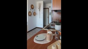 a kitchen with a sink and a counter top at Appartamento - Villaggio Terrata- Golfo Aranci in Marinella