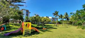 a playground with a slide in a park at Paraíso das Águas in Camacari