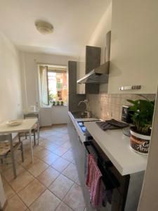 a kitchen with a sink and a counter top at Tra mare e arte in Lido di Ostia