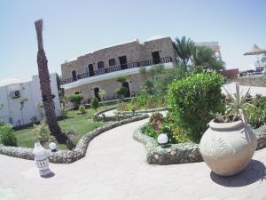 A garden outside Dolphin Continental Hotel