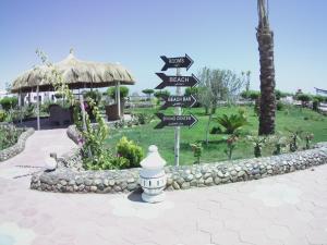 A garden outside Dolphin Continental Hotel