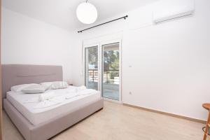 Posteľ alebo postele v izbe v ubytovaní Brand new maisonette in Chanioti, Chalkidiki