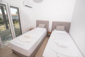 Posteľ alebo postele v izbe v ubytovaní Brand new maisonette in Chanioti, Chalkidiki