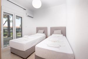 Posteľ alebo postele v izbe v ubytovaní Brand new maisonette in Chanioti, Chalkidiki