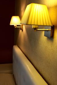 Postel nebo postele na pokoji v ubytování Hotel Felicia