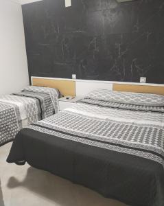Postel nebo postele na pokoji v ubytování Hostal la Campana
