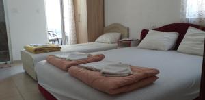 Postel nebo postele na pokoji v ubytování Apartmani Jacimovic