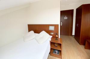 Posteľ alebo postele v izbe v ubytovaní Hotel EntreRobles