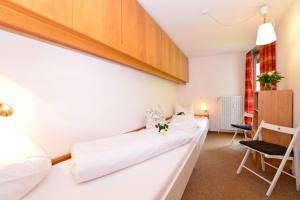 Posteľ alebo postele v izbe v ubytovaní Familienhotel Kleinwalsertal