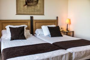 Postel nebo postele na pokoji v ubytování Termes Montbrio Hotel & Spa