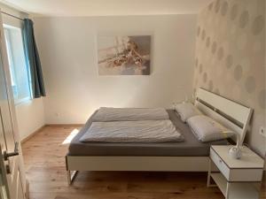 En eller flere senge i et værelse på Heike & Günther Ferienwohnung