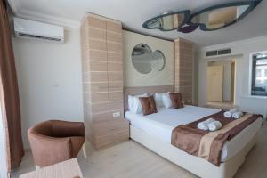 Postel nebo postele na pokoji v ubytování Hotel Caprea