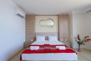 Postel nebo postele na pokoji v ubytování Hotel Caprea