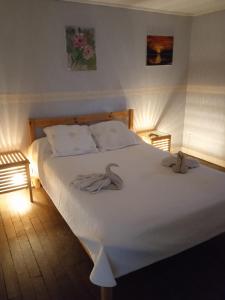 Postel nebo postele na pokoji v ubytování Auberge Gordonienne