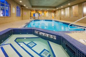 a large swimming pool in a hotel room at Holiday Inn Express Hotel & Suites Clarington - Bowmanville, an IHG Hotel in Bowmanville