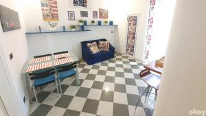 a living room with a checkered floor at House of Music - Bari Centro in Bari