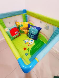 a childrens play bed with pillows on it at Legoland 3min Lakeview HappyRainbowSuite 7Pax 2R2B in Nusajaya