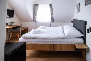 Posteľ alebo postele v izbe v ubytovaní Vila Markéta