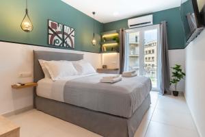 A bed or beds in a room at Mar25 by Smart Cozy Suites - In the heart of Athens - 9 minutes from metro - Available 24hr
