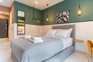 A bed or beds in a room at Mar25 by Smart Cozy Suites - In the heart of Athens - 9 minutes from metro - Available 24hr