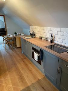 a kitchen with a sink and a counter top at Fabulous 2 Bed Apartment in Penrith