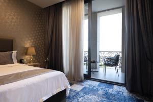 Rúm í herbergi á Sphera by Stellar Hotels, Yerevan