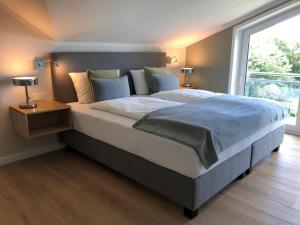 Ein Bett oder Betten in einem Zimmer der Unterkunft Gästehaus Muhl