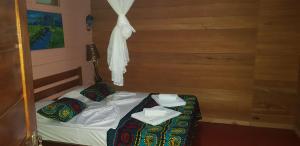 Ein Bett oder Betten in einem Zimmer der Unterkunft Roça Monte Forte
